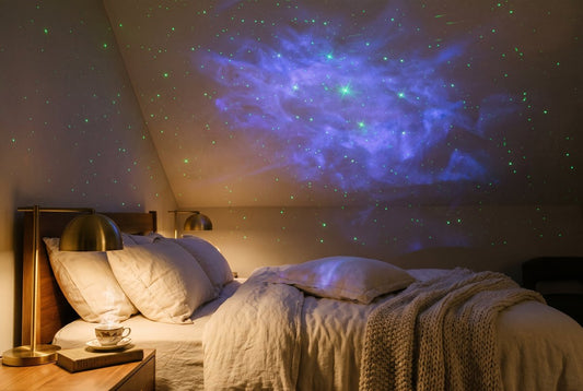Green laser stars and blue nebula on a bedroom ceiling