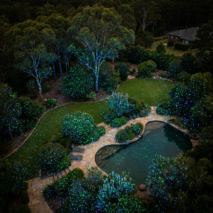 Aerial view of HighBright garden laser covering 40+ metres with blue and green pinpoint dots