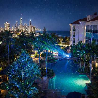 HighBright Professional Garden Laser Light Blue and Green — poolside garden lit with scattered green and blue laser dots