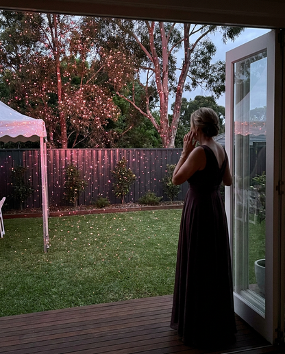 Crystal Lightfall Pink laser turning a backyard pink for an evening event
