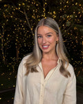 Sofia with the Yellow Firefly garden laser light - warm golden firefly dots across the trees and deck at night