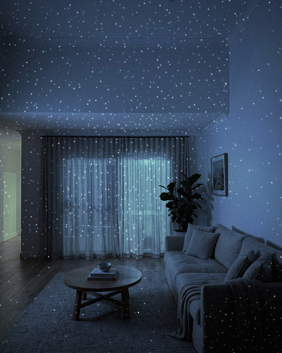 White Star laser points across the ceiling, walls and curtains of a lounge room at night